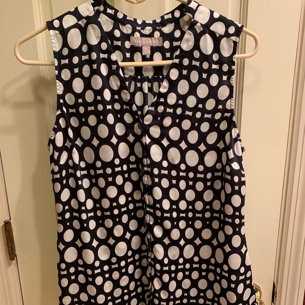 Sleeveless top that buttons up front; EUC